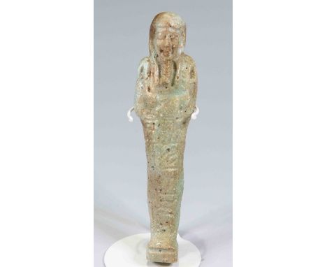 Egyptian Faience ShabtiLate Dynastic Period, C. 525 B.C.The figure is depicted in mummiform position in a greenish-blue faien