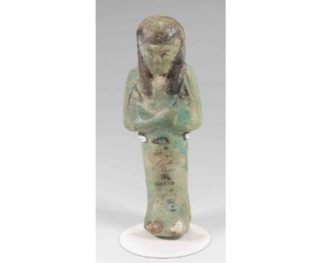 Egyptian Faience ShabtiThird Intermediate Period, Circa 900 BC.The figure is depicted in mummiform position showing agricultu