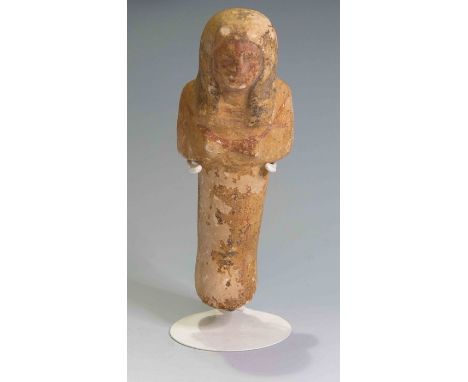 Egyptian Limestone shabtiA carved and painted mummiform figure. Summarily shaped, with round face, large face and some facial