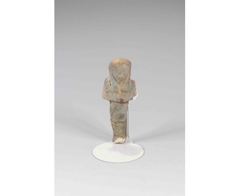 Egyptian Faience ShabtiThird Intermediate Period, Circa 900 BC.The figure is depicted in mummiform position showing agricultu
