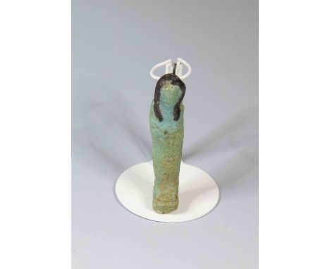 Egyptian faience shabtiPtolemaic Period, 300 - 32 BC.Very small mould-made simple mummiform worker figure: of flat shape with