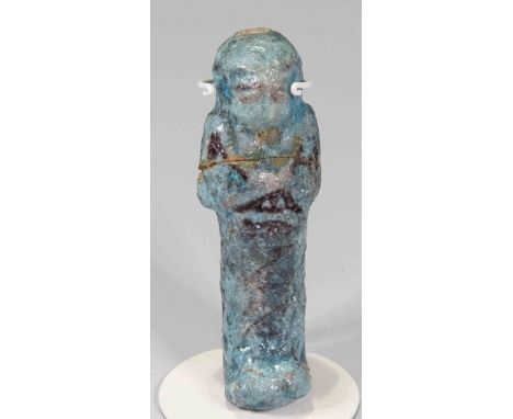 Egyptian Faience ShabtiThird Intermediate Period, Circa 900 BC.The figure is depicted in bright blue fiance in a mummiform po