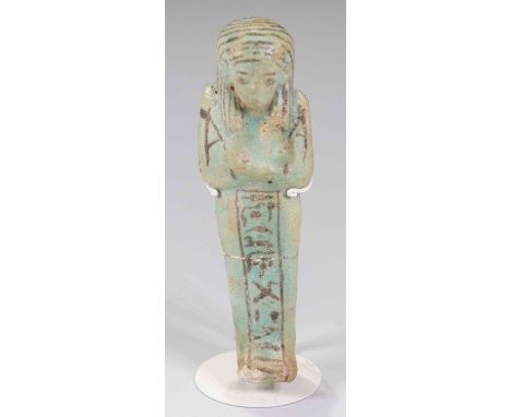 Egyptian Shabti for Worker Pa-Her-MerXXI - XXII Dynasty.Fine blue faience figure with detail added in black, wearing striped 