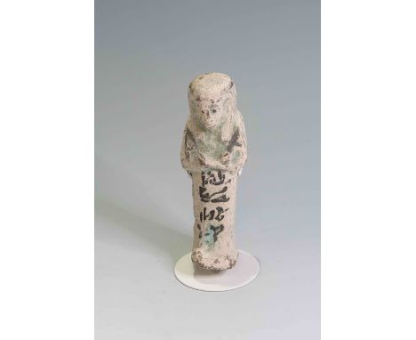 Egyptian Faience ShabtiThird Intermediate Period, Circa 900 BC.The figure is depicted in mummiform position showing agricultu