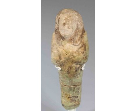 Egyptian Faience ShabtiThird Intermediate Period, Circa 900 BC.The figure is depicted in mummiform position showing agricultu