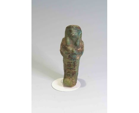 Egyptian Faience ShabtiThird Intermediate Period, Circa 900 BC.The figure is depicted in mummiform position showing agricultu