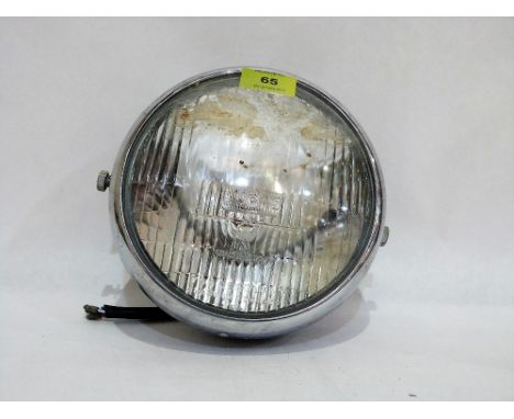 A Lucas headlamp for a BSA motorcycle