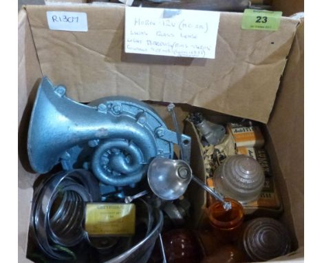 A box of sundries including a Magnette ZB horn, lamp bezels, contact set, Lucas lenses etc