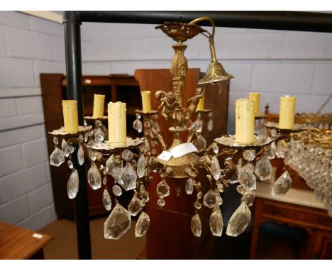 20th Century ceiling light fitting with brass cherub decoration, scrolled arms and glass droplets, 51cm wide