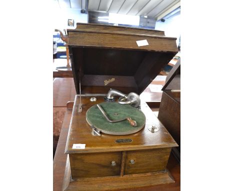 An early 20th Century oak cased gramophone by Dulcetto bearing retailers label for Wolsey &amp; Wolsey of Great Yarmouth, 42c