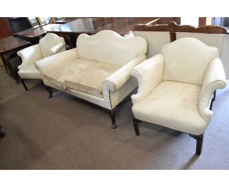 A small cream leather upholstered two seater sofa with camel back and mahogany cabriole legs, possibly Georgian or later, tog