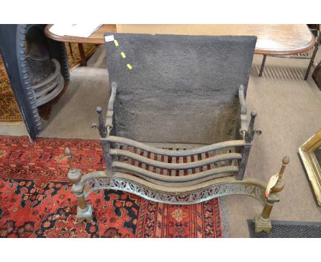 18th Century large brass and cast iron fire grate in the Georgian Neo-Classical style, the iron back plate fitted to a large 