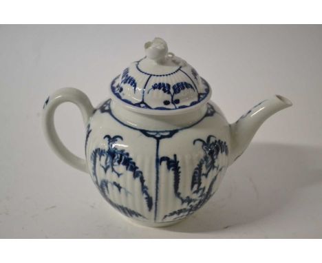 An 18th Century Worcester teapot and cover, the ribbed body decorated in underglaze blue with the Immortelle pattern