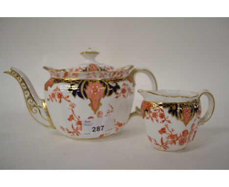 An early 20th century Royal Crown Derby teapot and creamer in a typical Imari designgood conditiion
