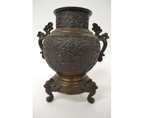A Japanese porcelain bronze vase raised on three dragon feet, 24cm high