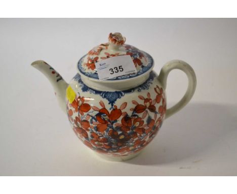 An 18th Century Worcester teapot, the blue and white design with clobbered iron red decoration