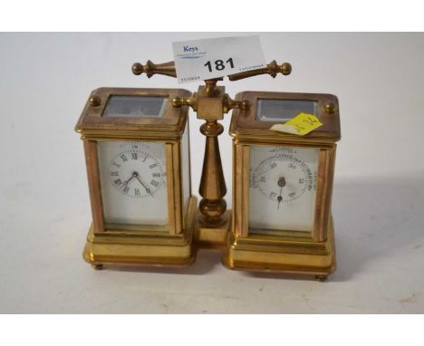 A combined small brass carriage clock together with a barometer