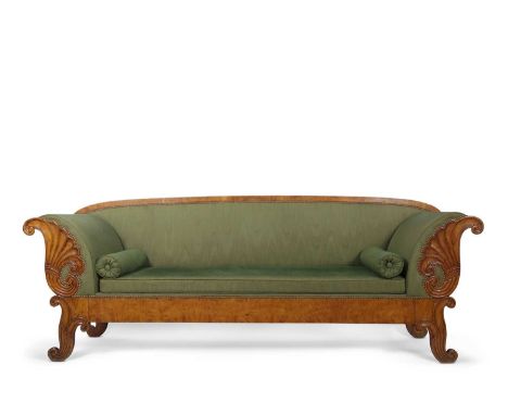 A large Scandinavian Biedermeier style birch sofa with green upholstery and bolster cushions, the front of each arm carved wi