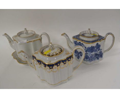 A group of three early 19th Century English porcelain teapots of turret shape, one marked pattern number 153, further blue an