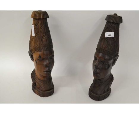 A pair of carved wooden ethnic tribal heads converted into lamps, 43cm high