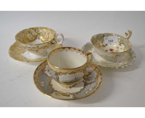 Three early 19th Century English porcelain cups and saucers all with typical painted floral and landscape decoration