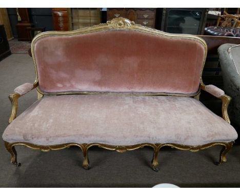 19th Century gilt wood framed sofa with arched back, open arms and serpentine front, upholstered in pink velour fabric, 170cm