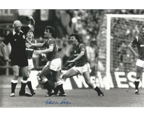 Football signed B/W, 12 x 8 photo depicting Manchester Uniteds Kevin Moran getting his marching orders from referee Peter Wil
