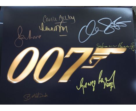 JAMES BOND, 14x11 inch photo signed by SEVEN actors and actresses who have starred in Bond films. Sir Roger Moore 007 James B