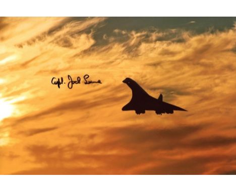 CONCORDE, 8x12 inch photo, a view of Concorde silhouetted against an orange sunset, signed by former Concorde Chief Pilot, Ca