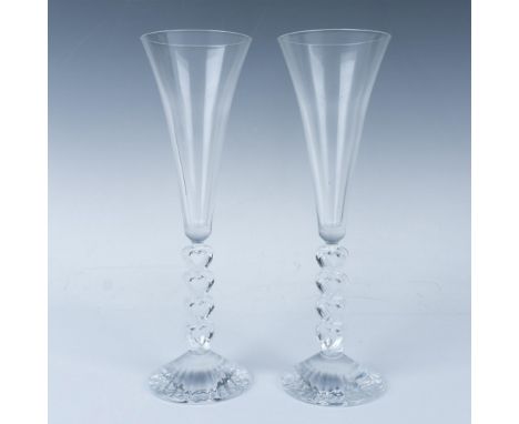 A set of 2, clear crystal with a sculpted heart stems. This item has its original box: 11.25"L x 7.25"W x 3.5"H. Issued: 1999