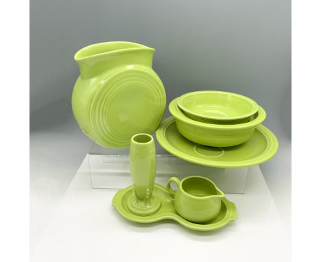 Eclectic ceramic set consisting of a small bud vase (2.75"W x 6.25"H), a medium vase with an ovular brim (4.25"L x 8"W x 8.75