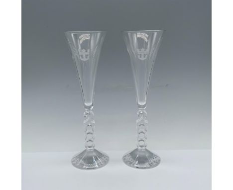 Gorgeous duo of celebratory glasses with a stem that reads the year 2000 and stamped with a Royal Caribbean logo. This item h
