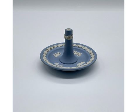 A round pottery jewelry accessory holder in a light blue matte finish. Beautifully decorated with white laurel wreath on the 