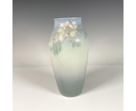 Serene blue pottery vase featuring a beautiful flower pattern on its body. Rookwood stamp, XII, and 925D at the bottom of the