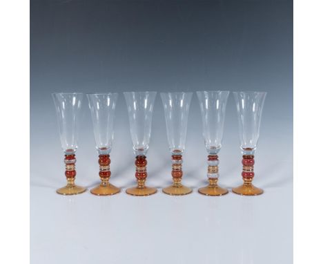 Funky glass cups with rounded stems used to hold sparkling wine. Issued: 20th centuryDimensions: 8"H x 2.75" dia. Condition: 