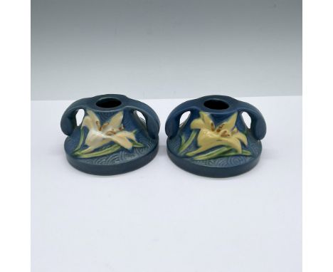 A set of 2 blue candlestick holders, each with double handles and decorated in a yellow and white flowers. Roseville U.S.A. 1