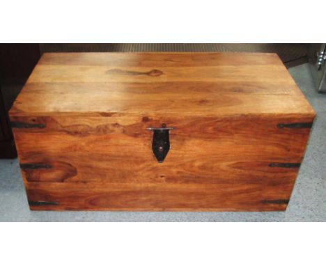 TRUNK, hardwood with a rectangular rising top, 113cm W x 49.5cm H x 61.5cm D. (with faults)