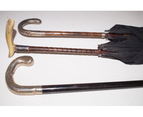 2 Silver Mounted Umbrellas together with a Silver Mounted Walking Stick (Stick AF) 