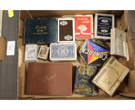 A SMALL TRAY OF ASSORTED PLAYING CARD SETS