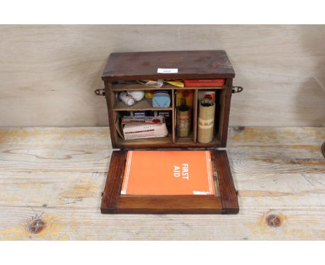 A WOODEN CASED PARAGON FIRST AID BOX AND CONTENTS 