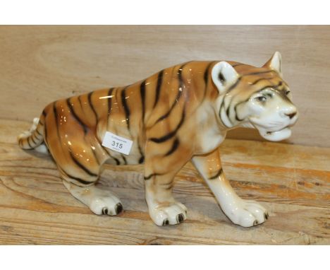 A LARGE ROYAL DUX CERAMIC PROWLING TIGER 