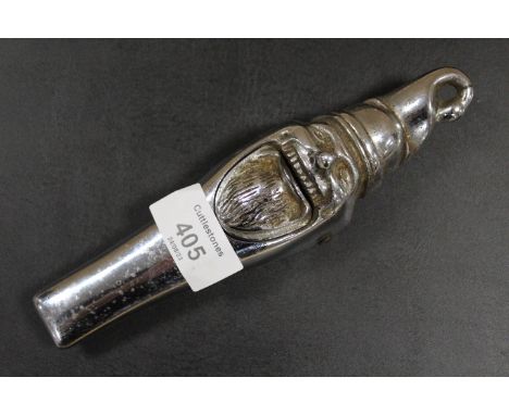 AN ANTIQUE NOVELTY CHROMED NUT CRACKER IN THE FORM OF A  GNOME 