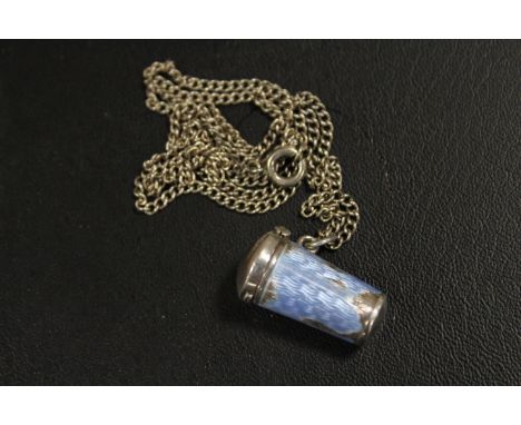 AN ANTIQUE SILVER AND ENAMEL PILL BOX ON SILVER CHAIN