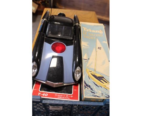 A TRAY CONTAINING INCREDIBLE'S DISNEY PIXAR REMOTE CONTROL CAR IN WORKING ORDER, A BOXED 12" TRIANG RACING YACHT, A GERMAN MA