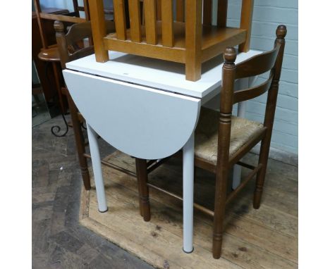 White formica topped kitchen table and a pair of rush seat ladder back style chairs 