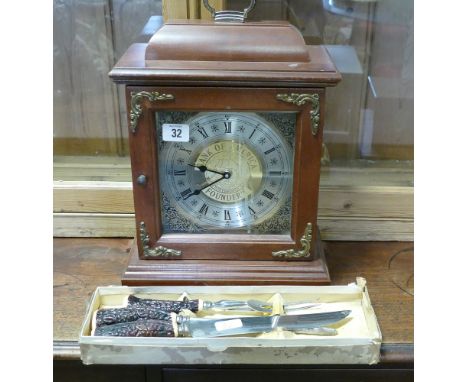 Reproduction bracket clock in mahogany case and a set of bone handled carvers 