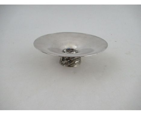 A 20th century Australian silver bowl, of circular form, the middle set with an opal surrounded by platypuses, raised on a ci