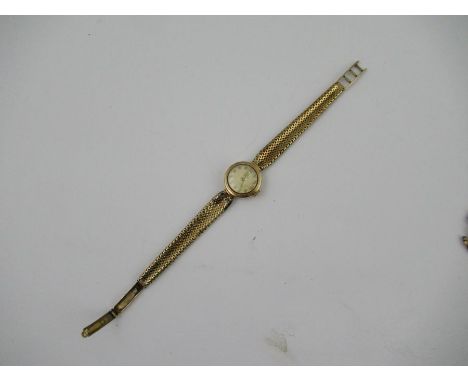 A 9ct Omega ladies watch, with woven bracelet and ladder clasp, stamped 1375, weight 20g&nbsp;