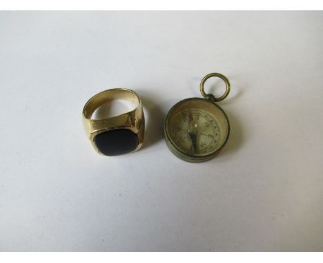 A gents signet ring, together with a small compass