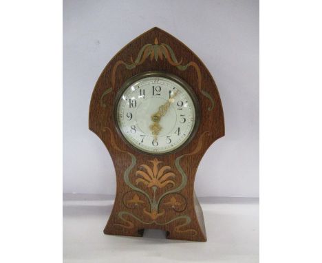 An Art Nouveau mantel clock, of typical form inlaid with pewter and cooper and a stylized floral design, height 11ins&nbsp;